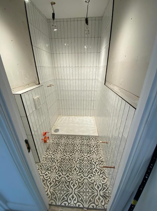 Bathroom renovation with white subway tiling
