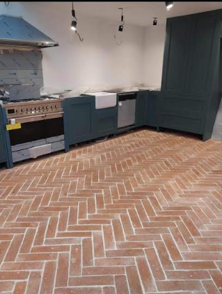 Kitchen with herringbone brick pattern tiling