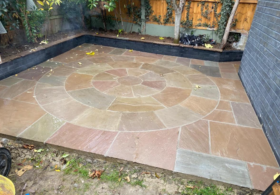 Garden patio with decorative circular stone pattern