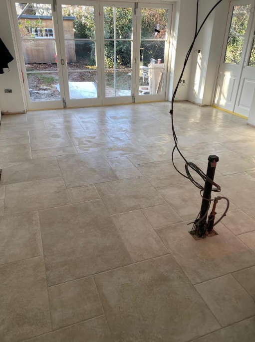 Floor tiling installation in progress