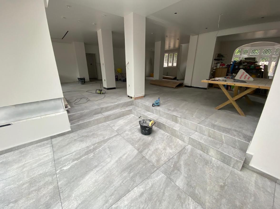 Floor tiling installation in progress