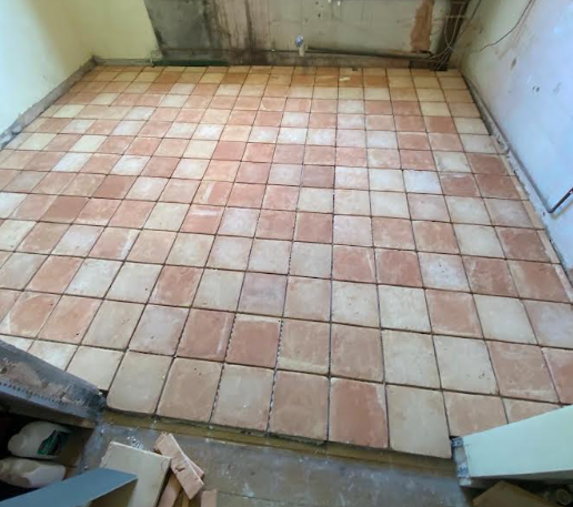 Floor tiling installation in progress