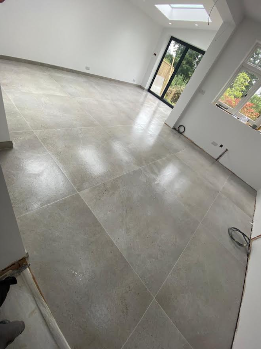 Floor tiling installation in progress
