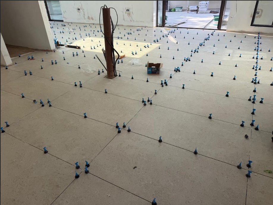 Floor tiling installation in progress
