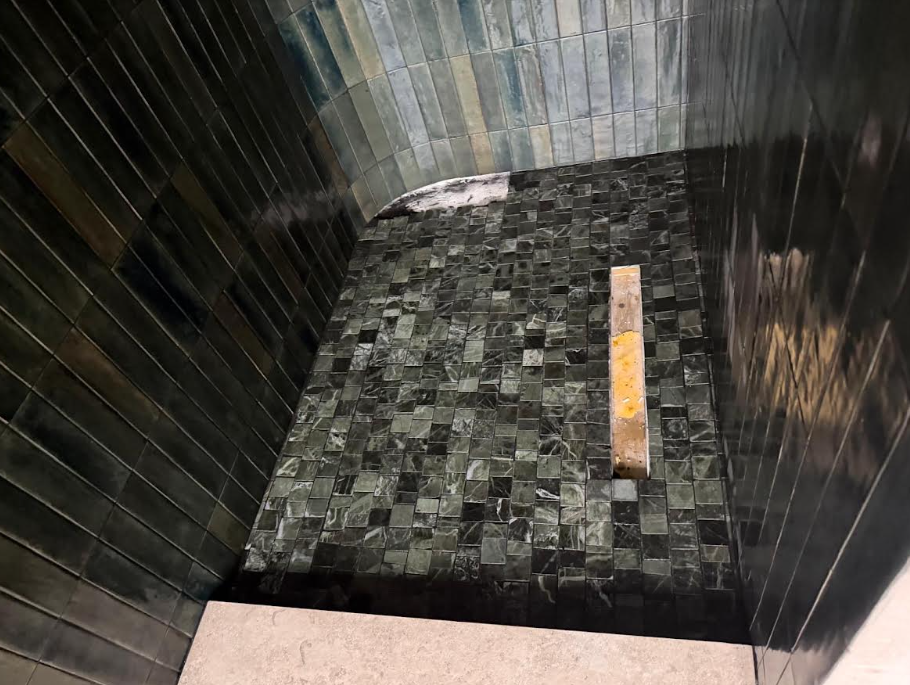Bathroom tile installation in progress
