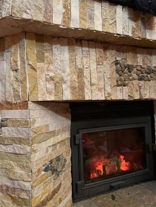 Fireplace with natural stone tiling